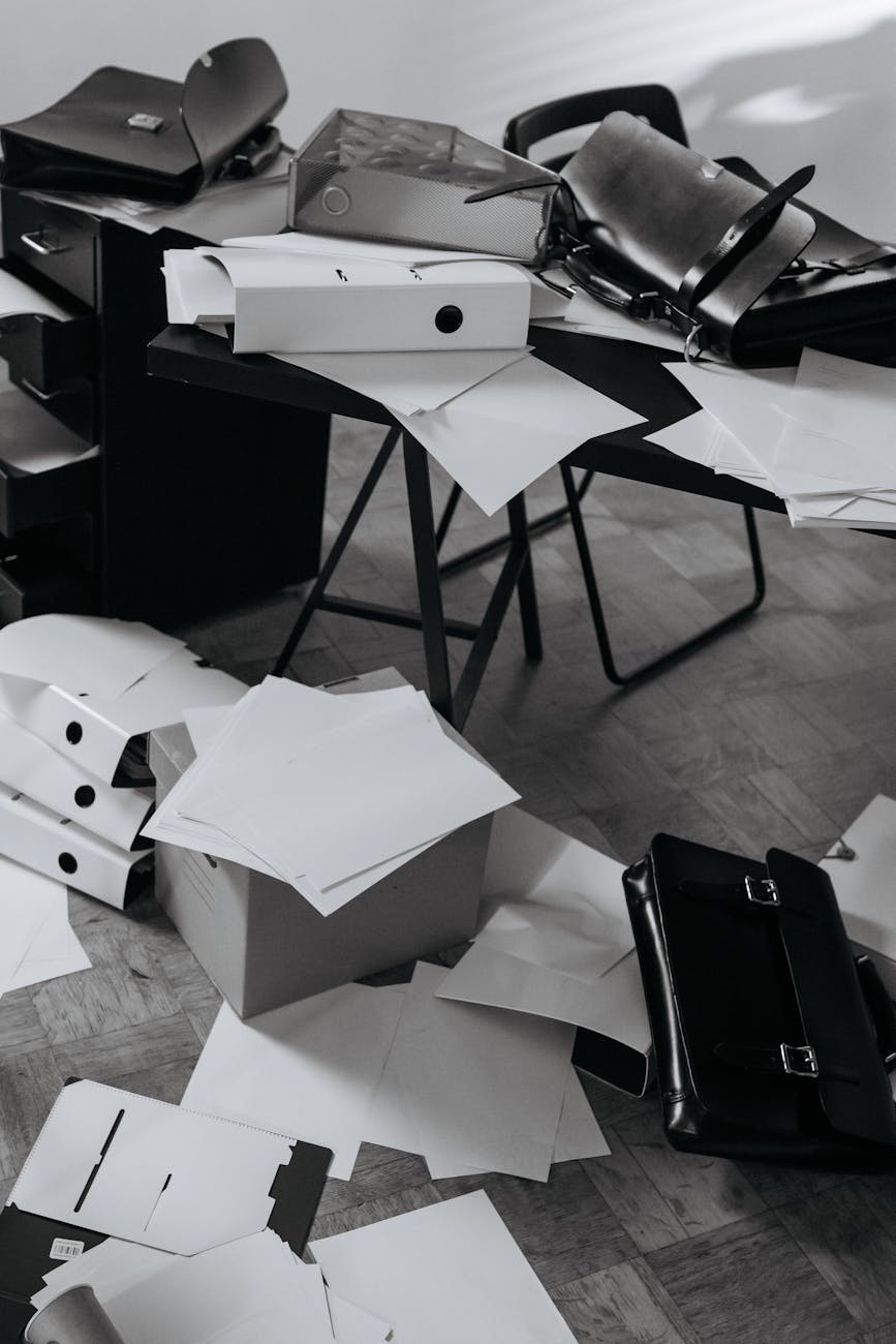 grayscale photography of a messy office